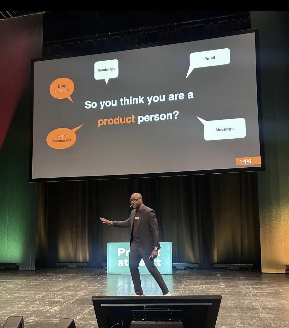 Christian Idiodi on stage beneath a product presentation slide